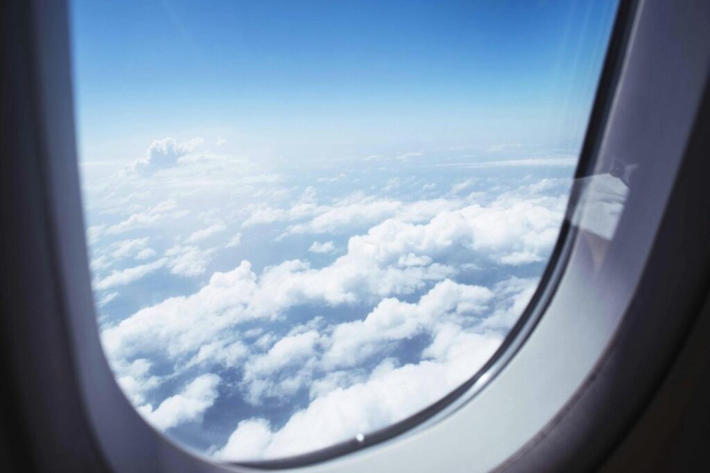 Clouds outside a plane window